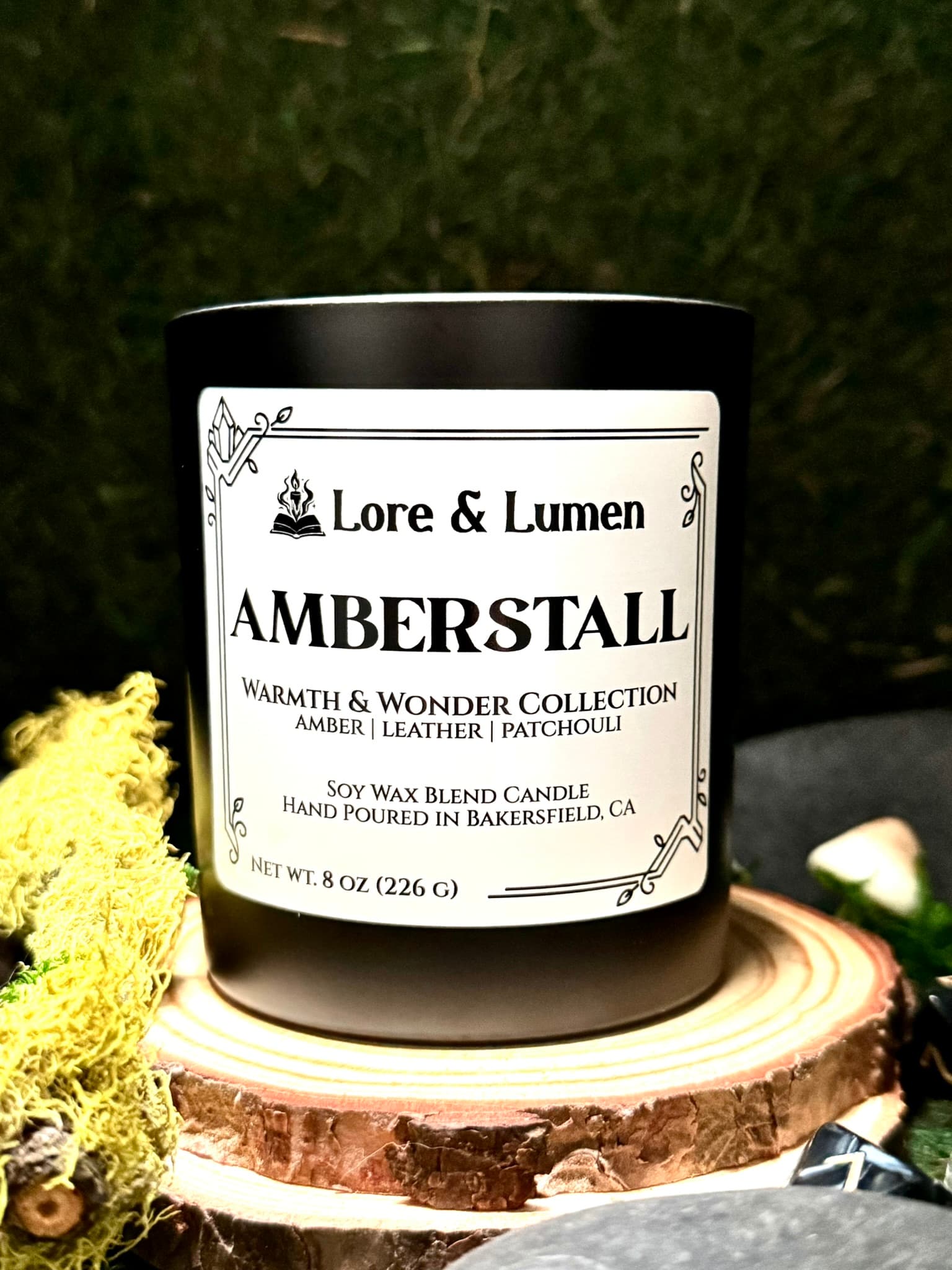 Amberstall fantasy candle with notes of vanilla and patchouli, styled for fantasy market scenes.