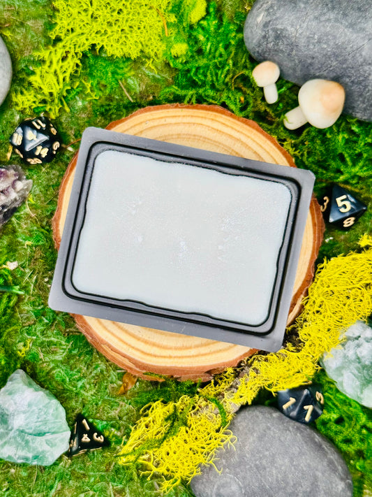 Frostveil fantasy wax melt with notes of cypress, fir, and evergreen, perfect for wintery or frosty realms.