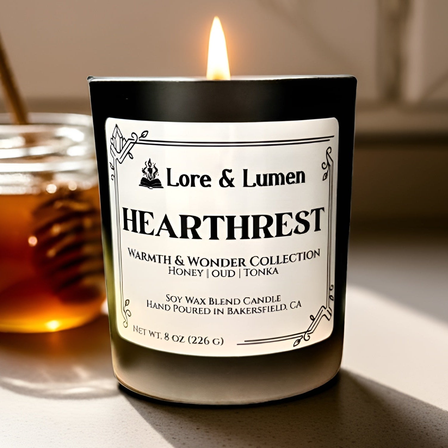 Hearthrest fantasy candle with notes of honey, oud, and tonka, styled for post-quest relaxation scenes.