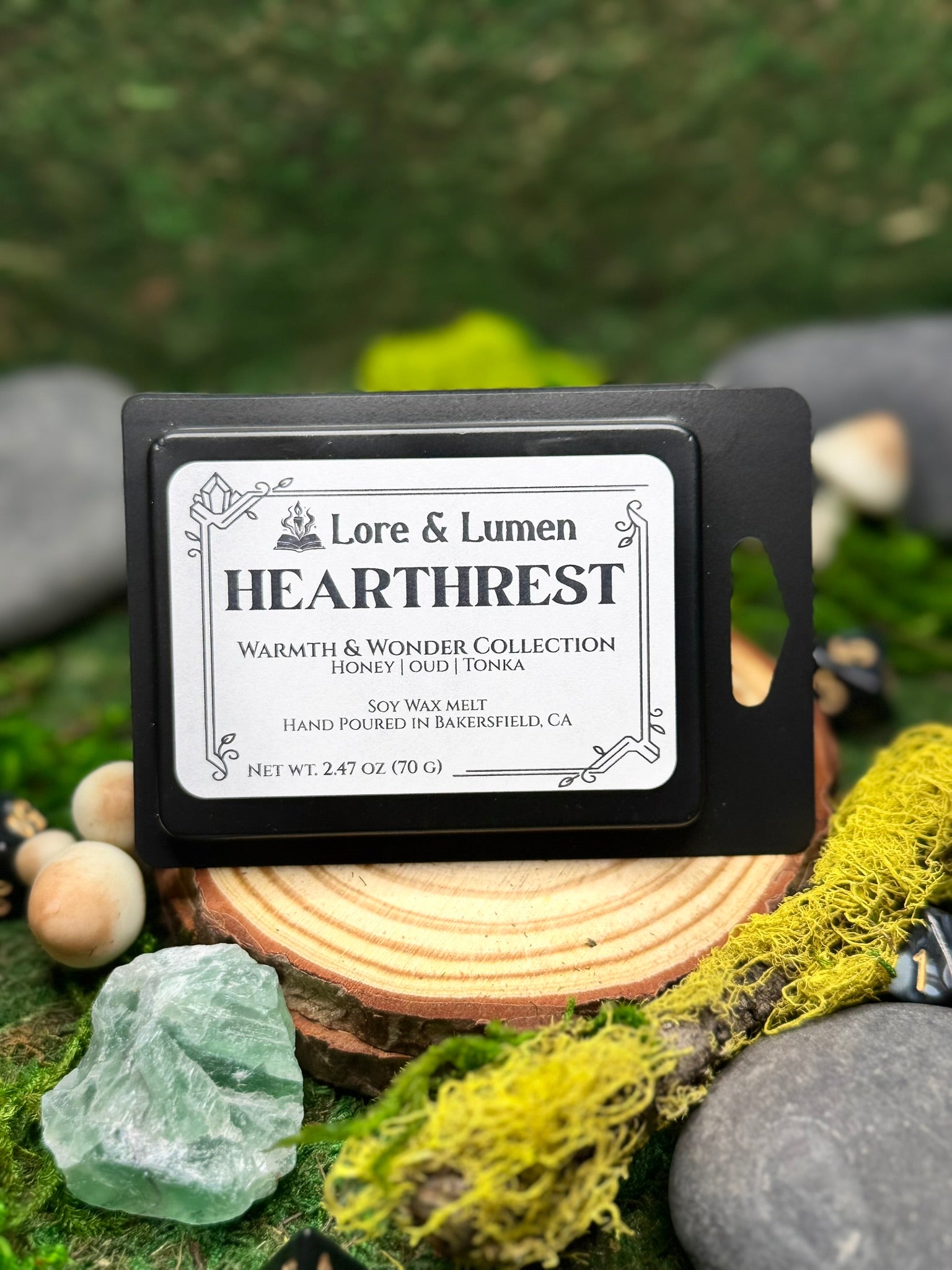 Hearthrest fantasy wax melt with notes of honey, oud, and tonka, perfect for post-quest relaxation scenes.
