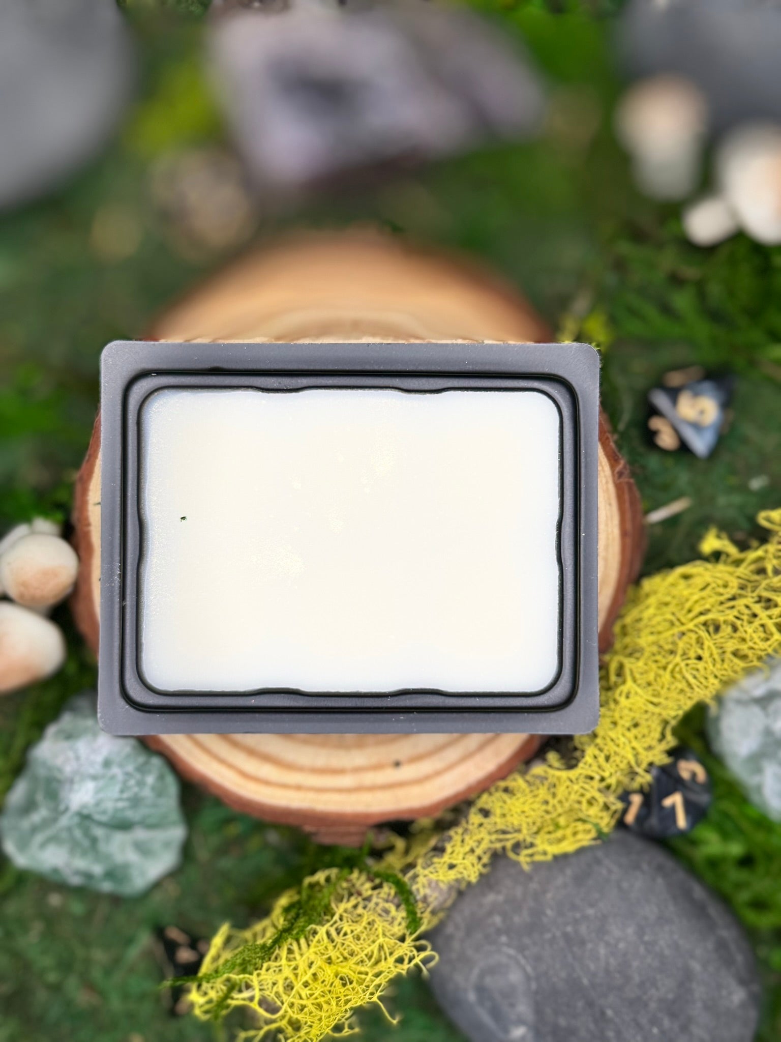 Hearthrest fantasy wax melt with notes of honey, oud, and tonka, perfect for post-quest relaxation scenes.