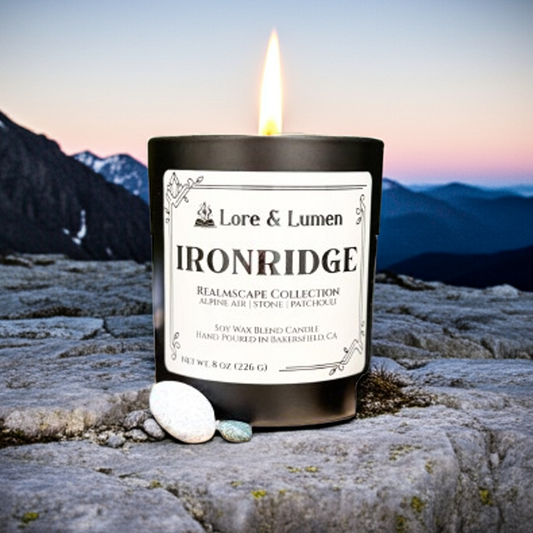 Ironridge fantasy candle with notes of alpine air, stone, and patchouli, styled for rugged mountain landscapes.