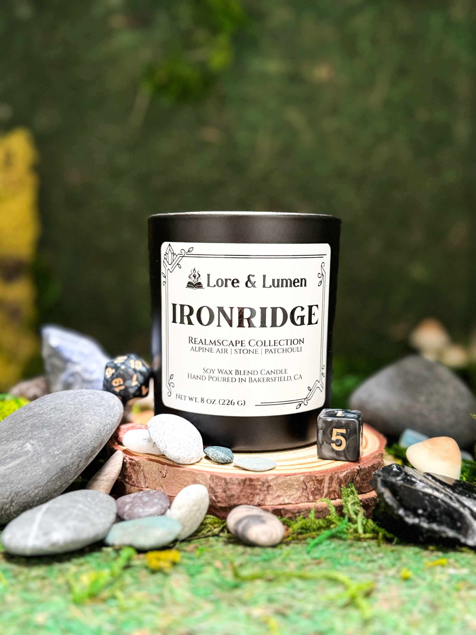 Ironridge fantasy candle with notes of alpine air, stone, and patchouli, styled for rugged mountain landscapes.