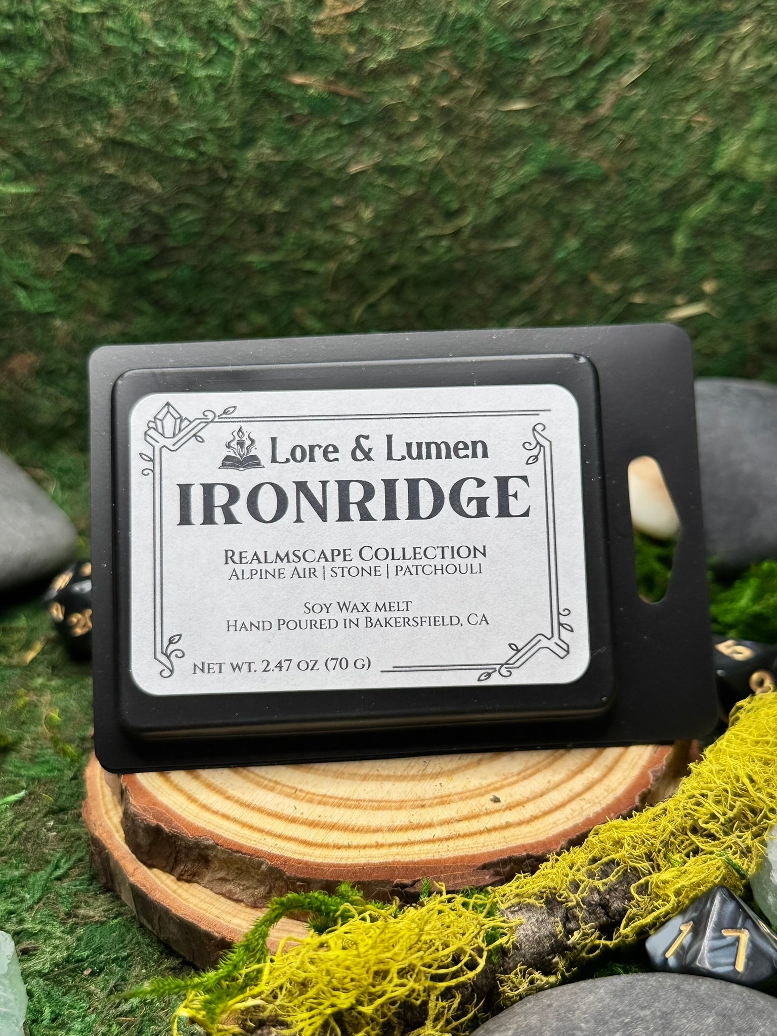 Ironridge fantasy wax melt with notes of alpine air, stone, and patchouli, perfect for rugged mountain landscapes.