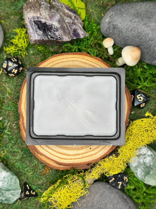 Ironridge fantasy wax melt with notes of alpine air, stone, and patchouli, perfect for rugged mountain landscapes.