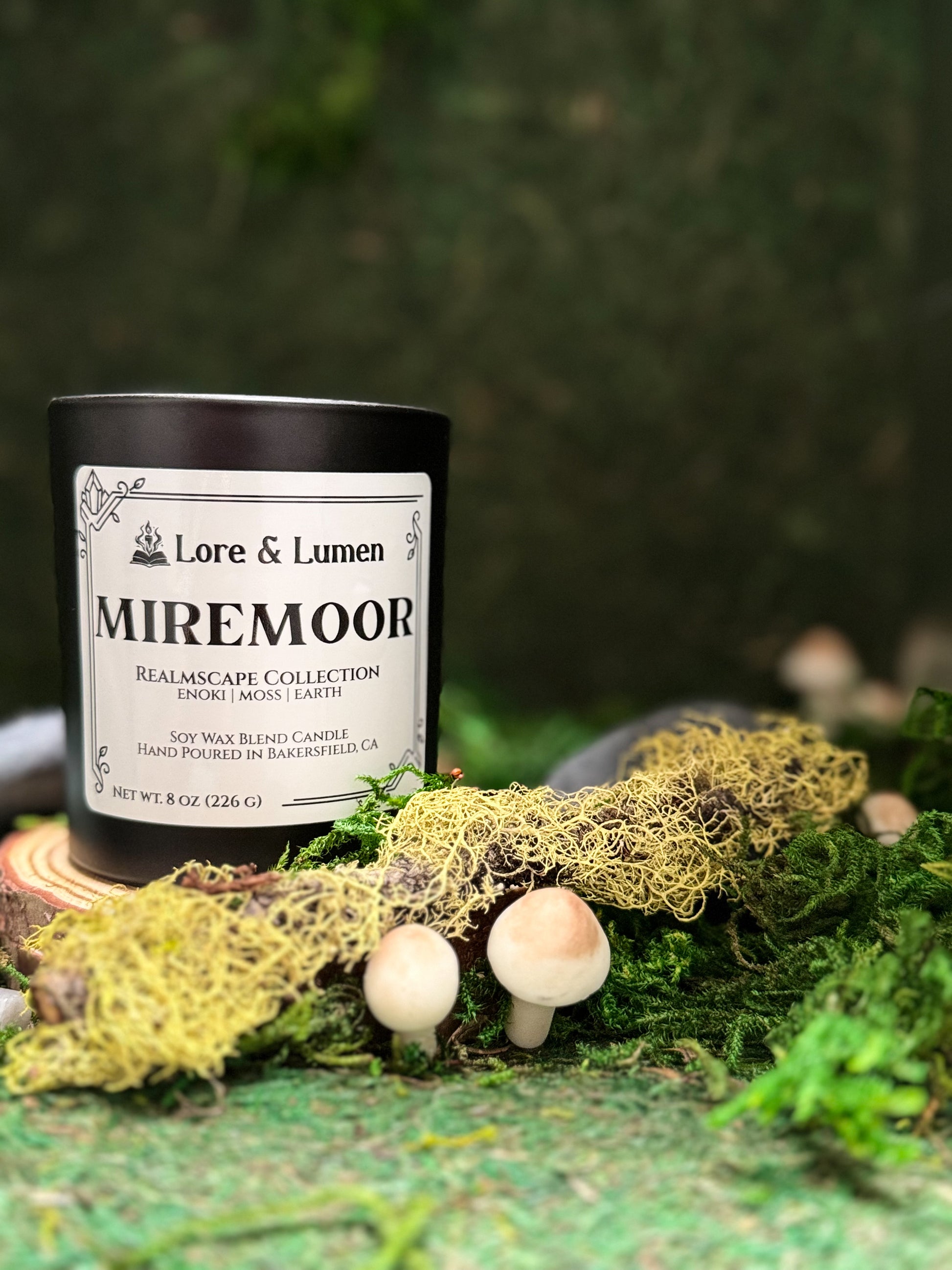 Miremoor fantasy candle with notes of enoki, moss, and earth, styled for swamp or marshland settings.