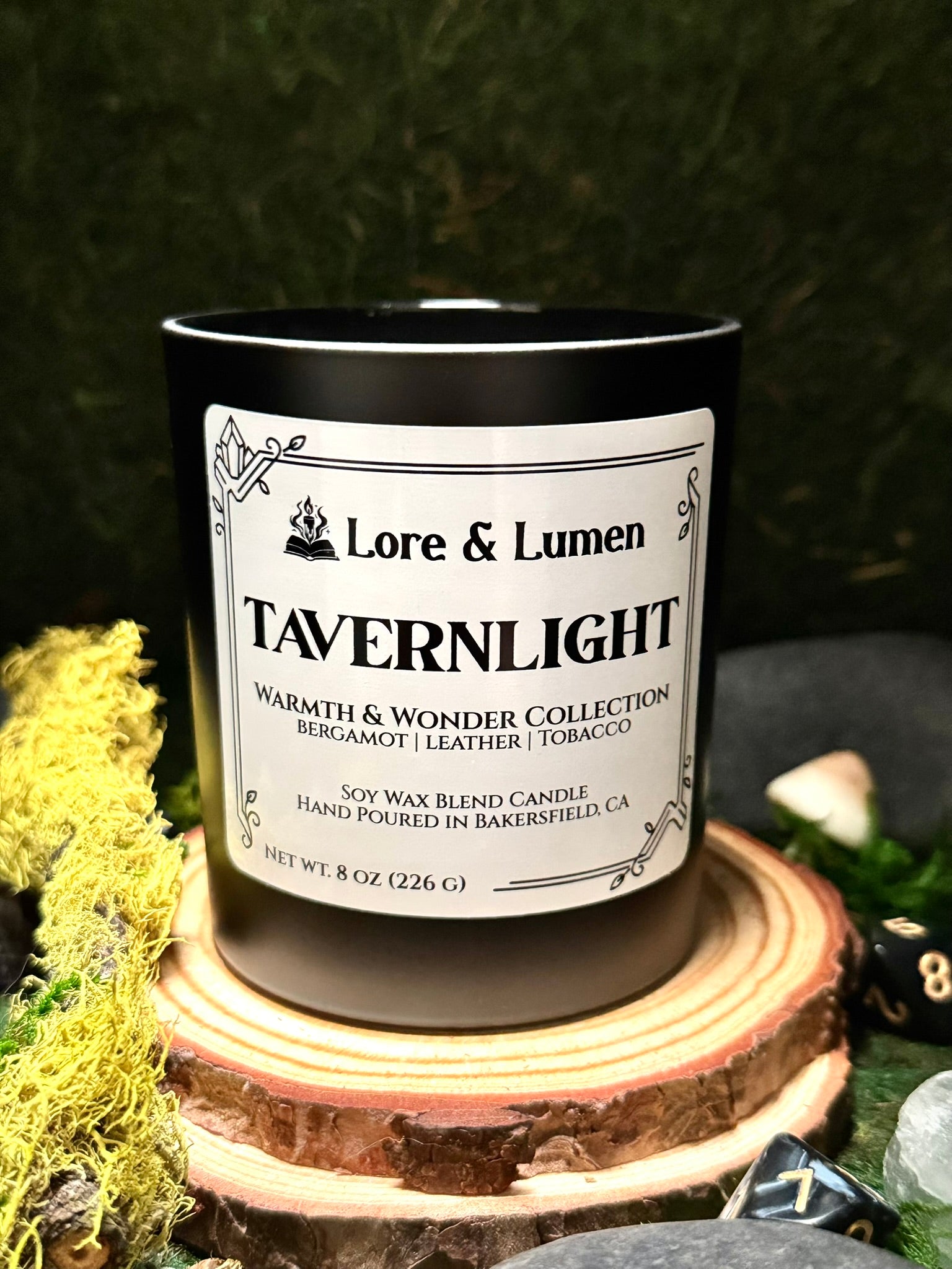 Tavernlight fantasy candle with notes of bergamot, leather, and tobacco, styled for cozy tavern interiors.
