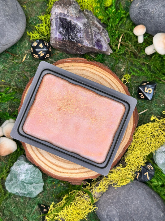 Tavernlight fantasy wax melt with notes of bergamot, leather, and tobacco, perfect for cozy tavern interiors.